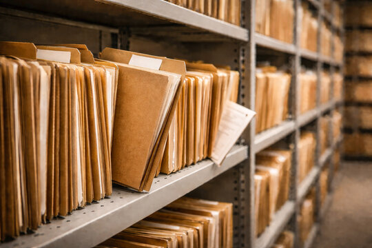Row of Professional Archive Folders on Metal Shelf in Storage Room