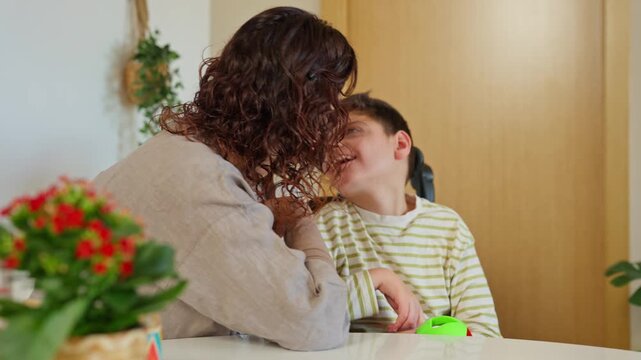 Mother providing loving care for son with cerebral palsy