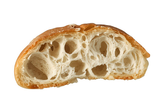 Freshly baked bread cut in half illustrating porous texture with open crumb and golden crust on transparent background