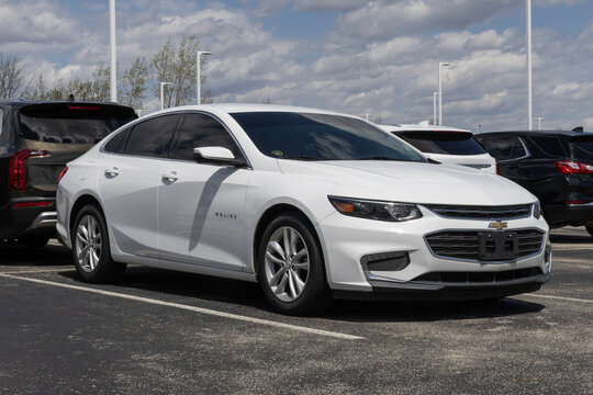 Used Chevrolet Malibu display. With pricing concerns, Chevy is buying and selling preowned vehicles to meet demand. MY:2018