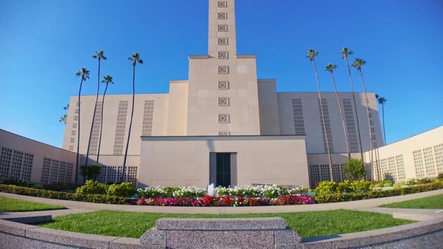 The Los Angeles California Temple Church stands prominently under clear skies on a bright sunny day