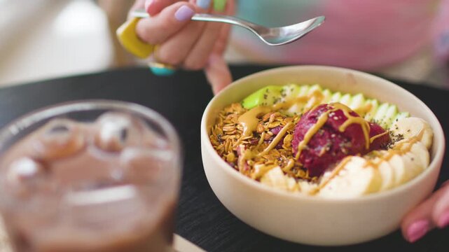 Healthy breakfast at a coffee shop. Healthy and delicious food. A girl is having breakfast at a cafe. Morning menu.