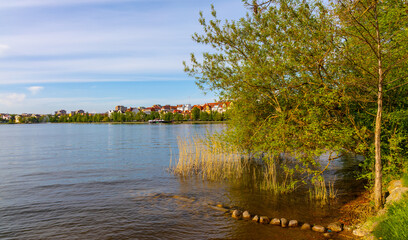 Panoramic view of Elk town with historic city center and waterfront promenade at Jezioro Elckie Lake in Mazuria lakeland region of Poland © Art Media Factory