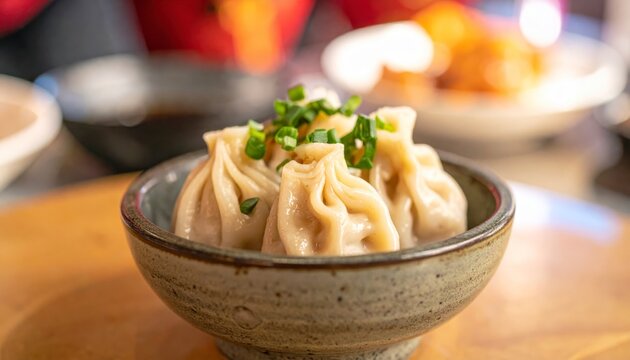 Plump Savory Pork and Chive Dumplings Pleated With Precision Nestled In A Small Bowl