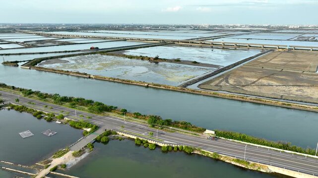 Aerial shot of large fish ponds along the coast of Taiwan used for farming fish and shrimp.