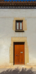 Fototapeta premium Elements of architecture of buildings, antique doors and gates with bars. On the streets in Catalonia, public places.