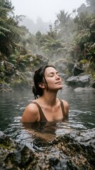 Fototapeta premium A serene woman enjoying a therapeutic soak in a natural misty hot spring surrounded by lush tropical vegetation in a tranquil and rejuvenating outdoor wellness sanctuary.