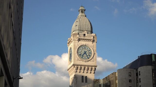 Warm afternoon light on the historic Gare de Lyon clock tower in Paris, France.