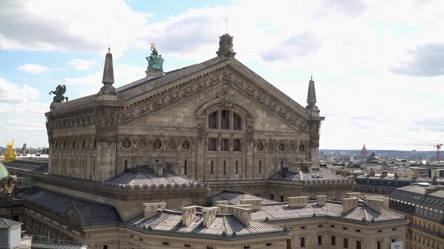 Historic neoclassical upper facade architecture of the Paris Opera House.