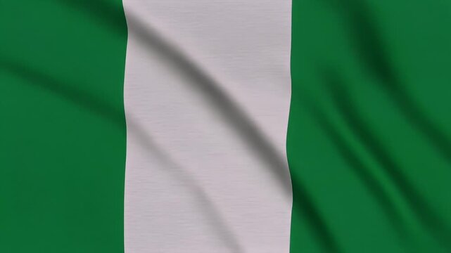 The Nigerian flag waves gently in the wind outdoors