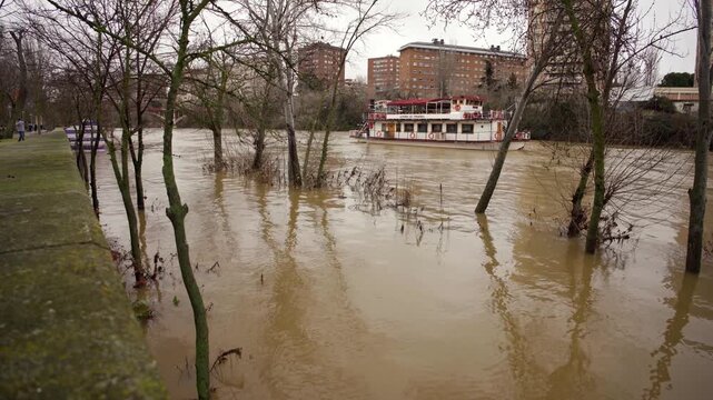 Water level of the overflowing pisuerga river receding in valladolid