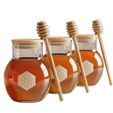 Three glass jars of honey with wooden dipsticks