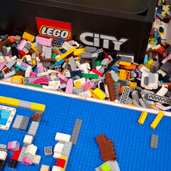 Obraz premium Assorted Plastic Building Blocks and Bricks with Lego City Brand Logo for Creative Construction Play and Educational STEM Activity on April 14, 2026 in Bangkok, Thailand