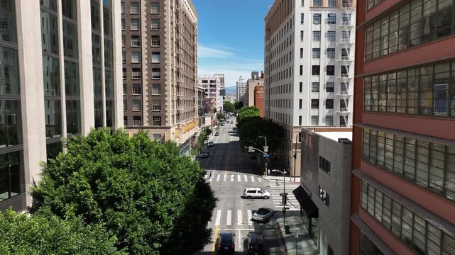 Los Angeles, California, USA - Aerial Drone Shot of Downtown Los Angeles Fashion District with Apartment Buildings, Commercial Spaces and Active Urban Streets
