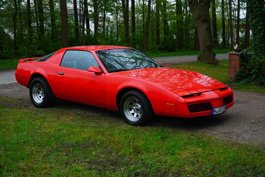 Orange red Pontiac Firebird