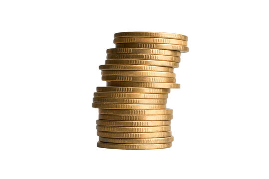 High stack of gold coins on black background representing financial risk and instability