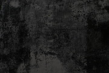 Obraz premium The texture of the old wall is rough and dark with faded paint.