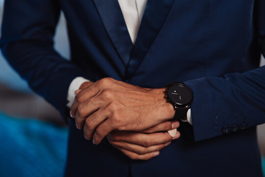 man in a suit getting ready