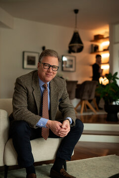 Portrait of a mature man sitting at home