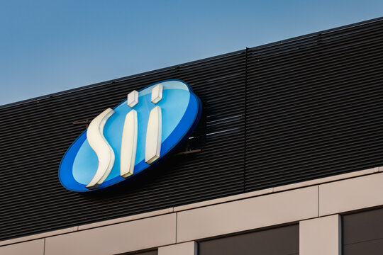 Wroclaw, Poland - March 19 2025: Modern Glass Office Building with Sii Company Logo in Wroclaw Poland at Sunset Contemporary Corporate Architecture and Branding in Golden Hour Urban District