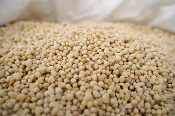 Fototapeta premium Ammonium nitrate. Background or texture. Selective focus. Nitrogen fertilizers as a component of plant nutrition. 