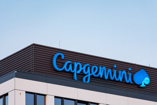 Wroclaw, Poland - March 27 2025: Capgemini Company Logo on Modern Glass Office Building in Wroclaw Poland at Sunset Contemporary Corporate Architecture and Branding in Golden Hour Urban Light