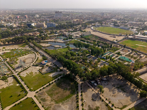 Aerial view of Rani Bagh park with its green lawns, small lake, and the Niaz Stadium in the background Hyderabad, Sindh, Pakistan.