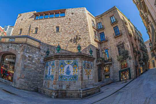 BARCELONA, SPAIN - APRIL 14, 2024: Font de Santa Anna, a medieval fountain built in 1356, located at the intersection of Carrer de la Cucurulla and Avinguda del Portal de l'&Agrave;ngel, Ciutat Vella.
