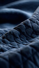 Fototapeta premium Object Only Quilted Airplane Blanket Folds Side Lit Texture Slight Glimpse Pillow