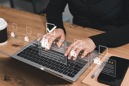 Real estate comparison concept. Professional using laptop to review home listings, ratings and property details on digital platform for online house search, selection, evaluation and buying decisions