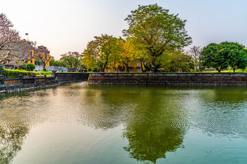 Fototapeta premium A view across the northern moat of the Imperial City in Hue, Vietnam in the early evening