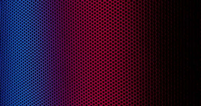 Close-up view of a color perforated surface with a repeating hole pattern, creating a textured and industrial look.