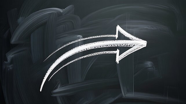 White chalk arrow drawn on a blackboard pointing right with blackboard direction progress education learning strategy planning movement pointing communication indication objective guidance