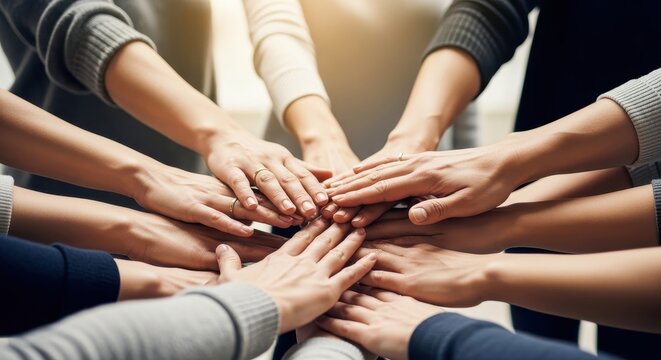 a group of people putting their hands together in a circle as a symbol of teamwork and unity and tog