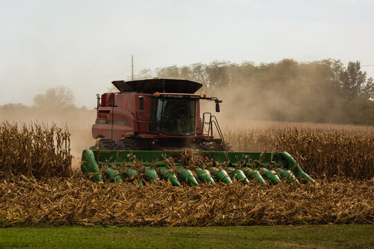 Farmer driving a combine harvester with a corn head during harvest in Versailles, Missouri, September 2022