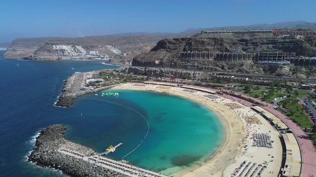 Aerial view of Amadores beach and turquoise bay with luxury hotels on the volcanic cliffs, Gran Canaria