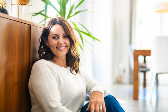 Beautiful aging. Portrait pretty mature female pensioner sit on the floor