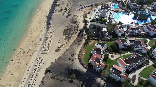 Aerial view of luxury beach resort with pools and turquoise ocean in Costa Calma, Fuerteventura