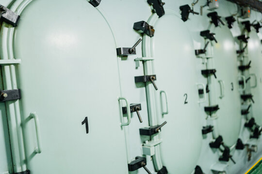 Crankcase doors of a massive marine main engine during inspection.