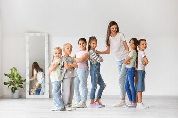 Obraz premium Group of little children with teacher in dance studio