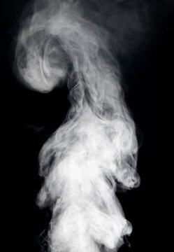 Abstract white smoke swirling and rising against a stark black background