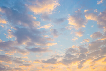 Fototapeta premium Beautiful evening sky with orange and blue clouds during sunset.