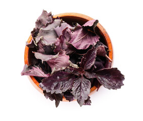 Naklejka premium Wooden bowl with fresh purple basil leaves on white background