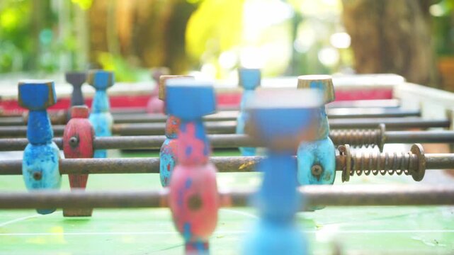 A close up view of a row of colorful plastic pipes and toys arranged on a table for a crowd at Christmas