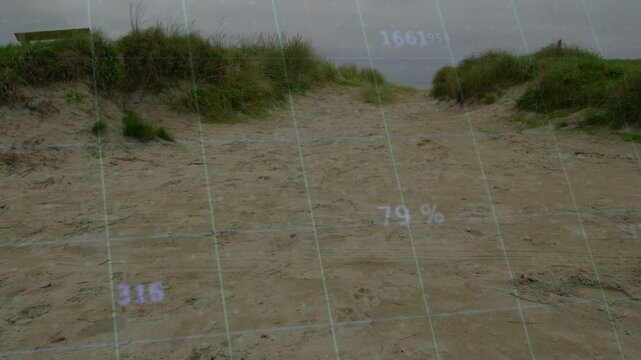 Holographic overlay appearing over sand path, numbers and grid rising for coastal survey