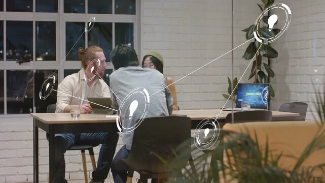 Tech team of 3 working, leaning over tablet, man tapping, colleague joining, forming live node web