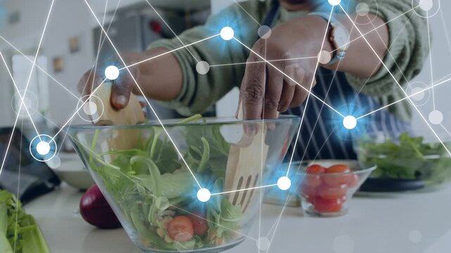 Hands entering frame grabbing wooden forks woman tossing salad making meal network overlaying food