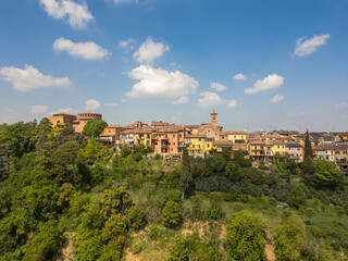 Fototapeta premium Italy, 10 April 2026: Aerial drone view of Dozza medieval village in Emilia Romagna, featuring the historic Rocca Sforzesca fortress, colorful murals, tiled rooftops, and scenic Italian countryside la