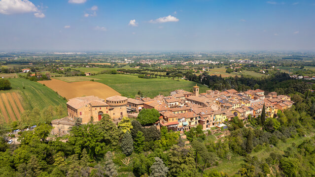Italy, 10 April 2026: Aerial drone view of Dozza medieval village in Emilia Romagna, featuring the historic Rocca Sforzesca fortress, colorful murals, tiled rooftops, and scenic Italian countryside la