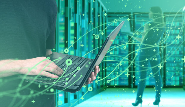 Artificial intelligence, Server room operations. Technician uses laptop to manage data flows and network systems in data center, digital processing and cybersecurity monitoring.